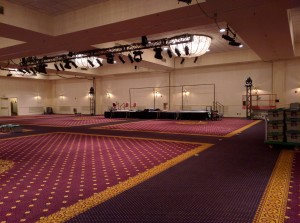 A mostly bare Grand Ballroom awaits installation of the backdrop, A/V equipment, and seating